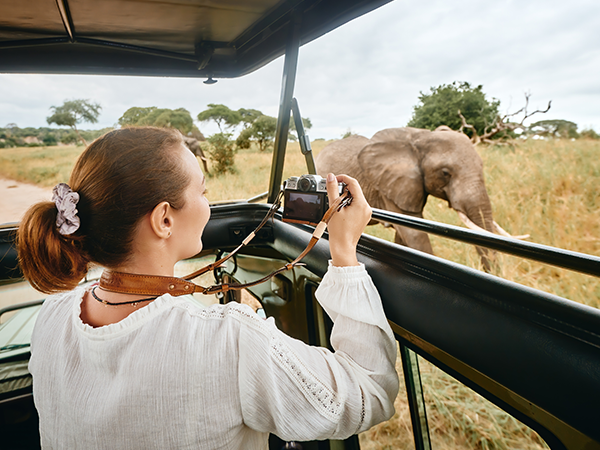 Woman taking pictures at safari park